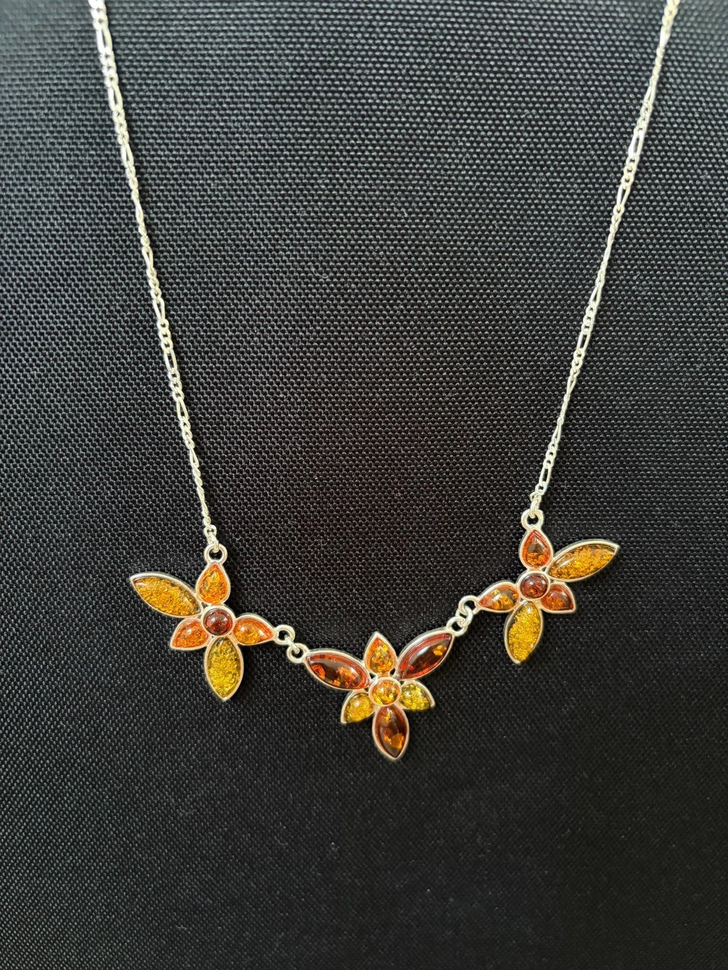 Silver Figaro Chain Set With 3 Assorted Colour Amber Floral Sections