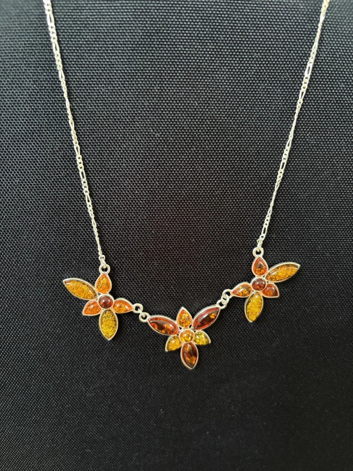 Silver Figaro Chain Set With 3 Assorted Colour Amber Floral Sections